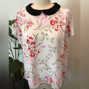 CeCe floral top with black collar.